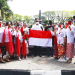 Alumni Halokes Mbois Bentangkan Bendera Merah Putih 366 Meter di Alun-alun Tugu